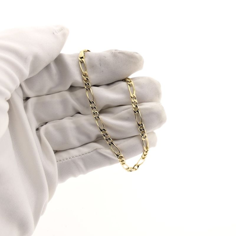 Image 5 of Gold closed Figaro link bracelet.