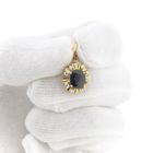 Image 10 of 18-karat gold pendant with sapphire and diamond | 0.12 ct.