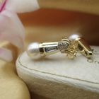 Image 8 of 18 carat gold stud earrings with cultured pearl and 0.18 ct diamond.