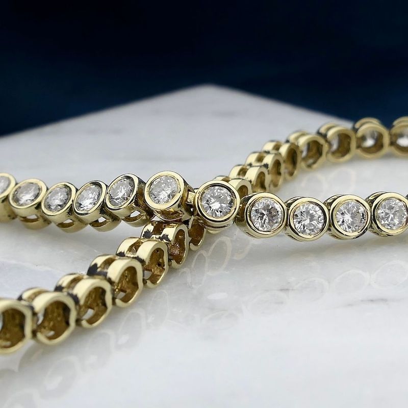 Image 2 of Gold tennis bracelet with diamonds; 5.60 ct.