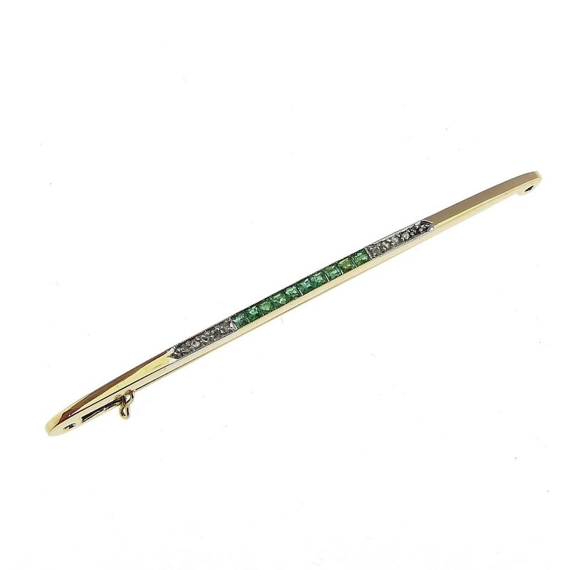 Image 1 of Long, narrow gold brooch with emerald and diamonds; approx. 0.06 ct.