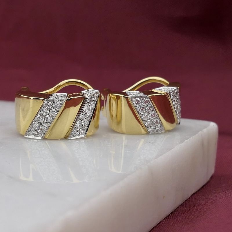 Image 2 of Gold stud earrings set with diamonds; 0.70 ct.
