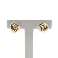 Gold stud earrings as a button