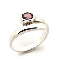 Silver solitaire ring with an oval cut amethyst stone