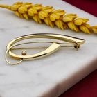 Afbeelding 2 van Vintage gouden abstracte broche met zirconia
