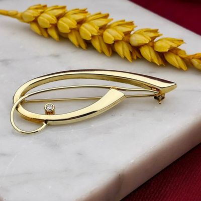 Afbeelding 2 van Vintage gouden abstracte broche met zirconia