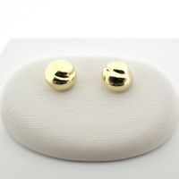 Gold stud earrings with large round button