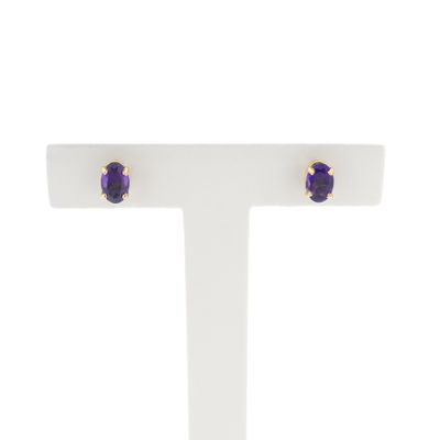 Gold stud earrings with synthetic purple gemstone Image 1 of Gold stud earrings with synthetic purple gemstone