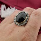 Image 7 of Gold and silver ring with garnet and diamonds; Approx. 0.20 ct.