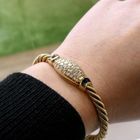 Image 12 of 18-karat gold twisted bracelet with sapphire and diamond; 1.11 ct. | Wellendorff