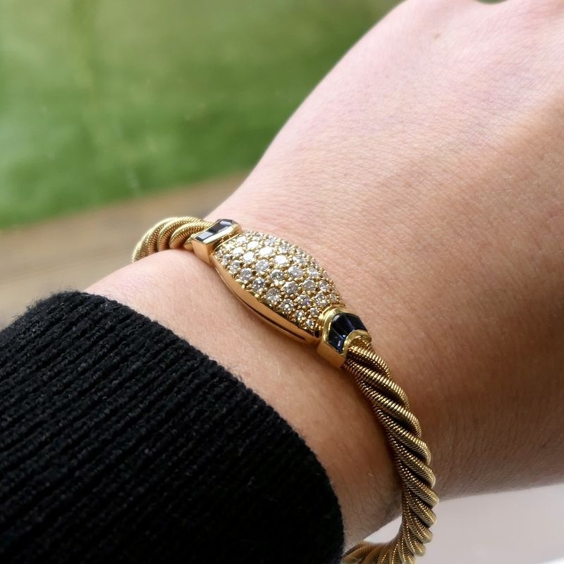 Image 12 of 18-karat gold twisted bracelet with sapphire and diamond; 1.11 ct. | Wellendorff