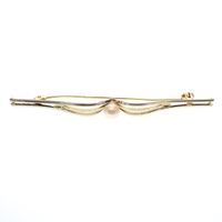 Two-tone gold brooch with pearl