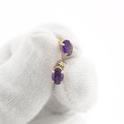 Image 11 of Gold stud earrings with synthetic purple gemstone