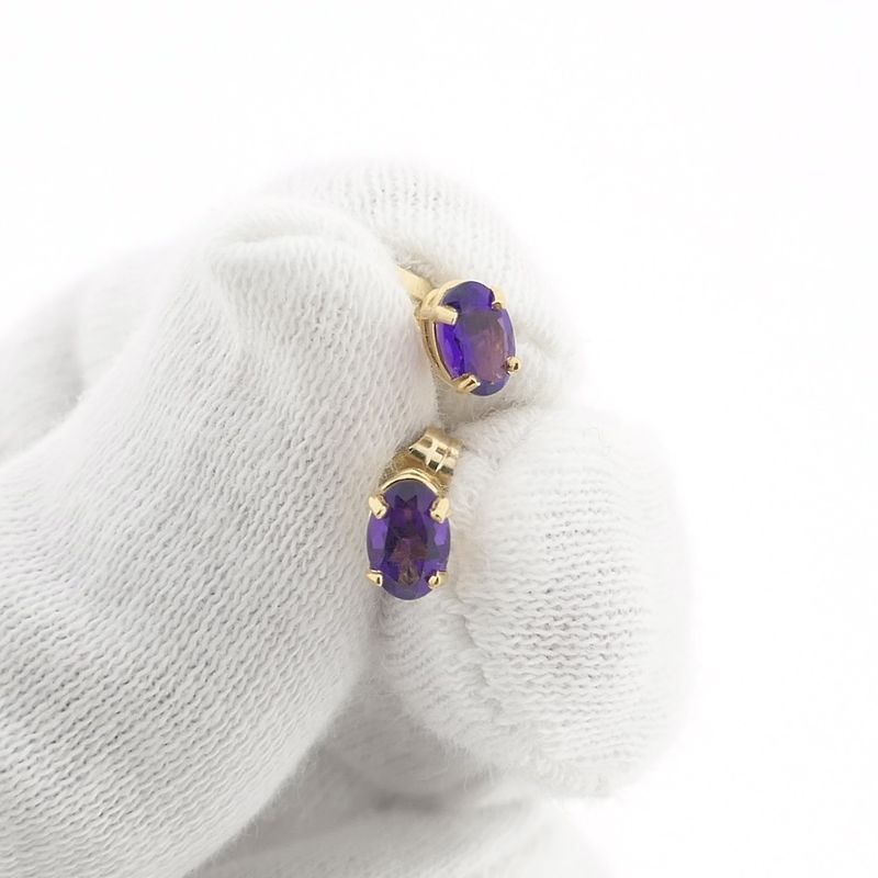 Image 11 of Gold stud earrings with synthetic purple gemstone