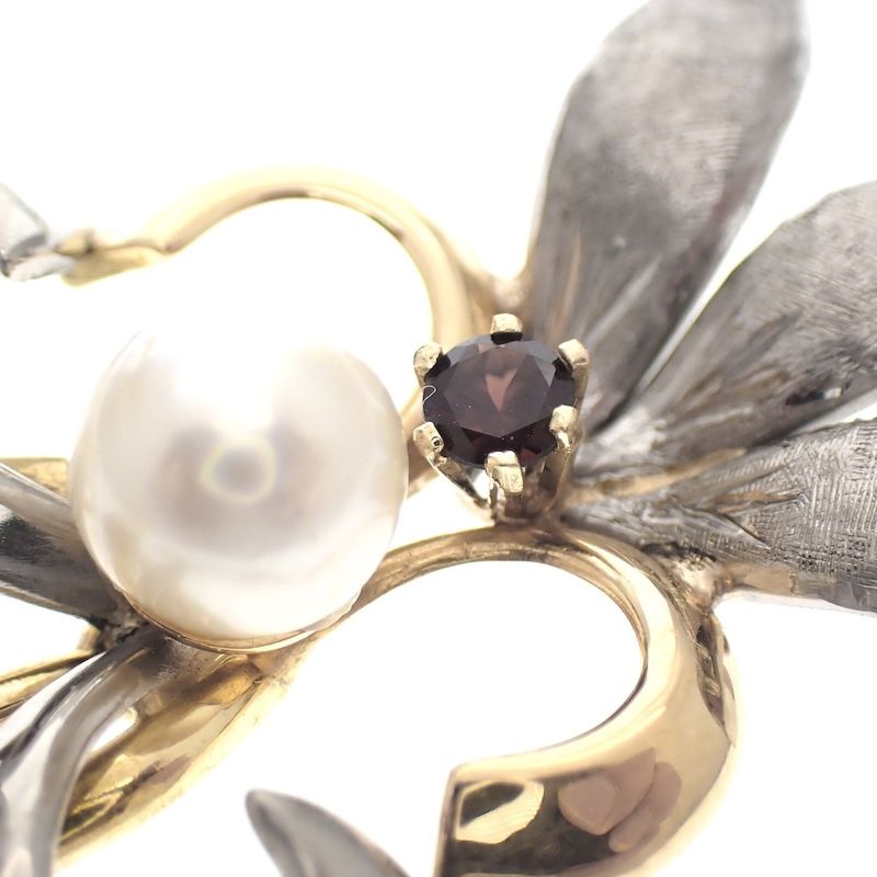 Image 4 of Two-tone gold pendant of a French lily with pearl and garnet