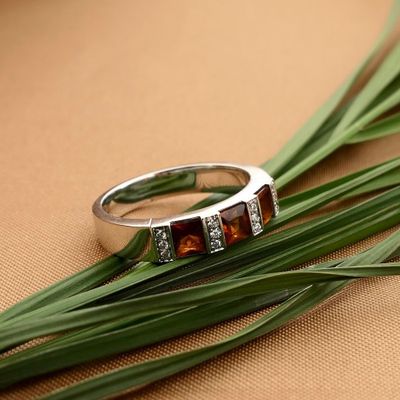 Image 2 of White gold ring with orange tourmaline and diamonds; 0.12 ct.