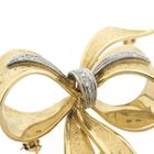 Image 3 of Gold brooch in the form of a bow with diamonds; 0.035 ct.