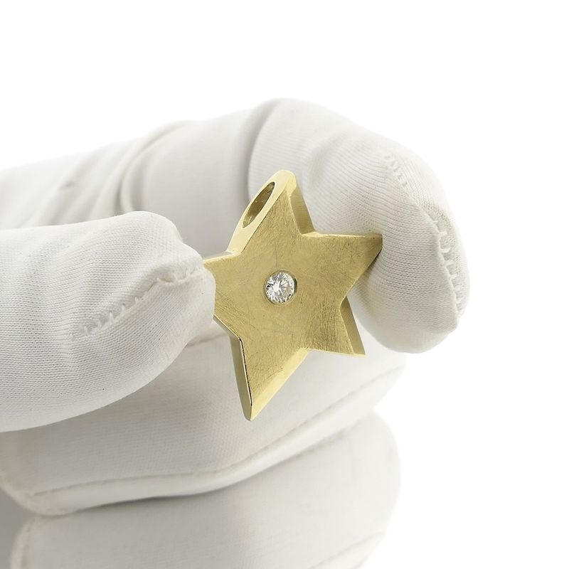 Image 12 of Gold star pendant with diamond; 0.14 ct.