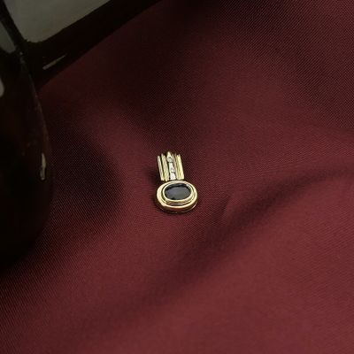 Image 2 of Two-tone gold pendant with sapphire and diamond | 0.01 ct.