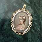 Image 2 of Vintage two-tone gold pendant/brooch with a painted portrait and diamonds; 0.015 ct.