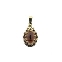 Vintage gold entourage pendant with garnet