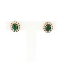 Gold earrings with emerald and diamonds; 0.48 ct.