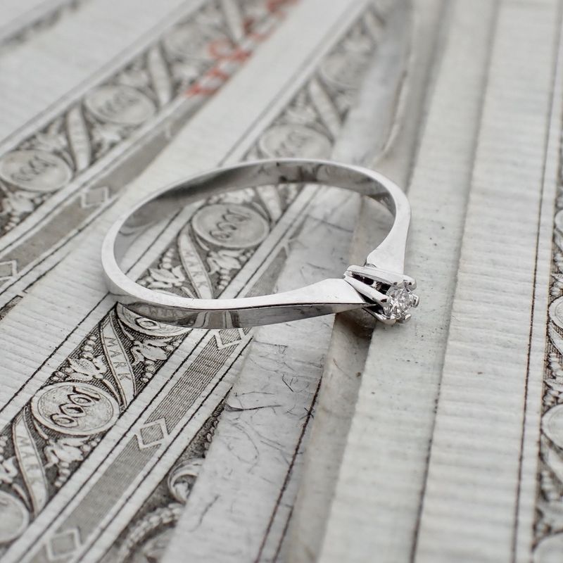 Image 2 of White gold solitaire ring with 0.04 ct diamond.