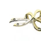 Image 6 of Two-tone gold bow pendant with diamond | 0.04 ct.