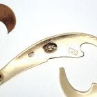 Image 3 of Gold letter brooch; letter T