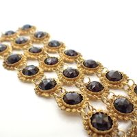 Antique gold bracelet with garnet stones.