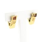 Image 2 of Gold stud earrings with synthetic orange sapphire and zirconia