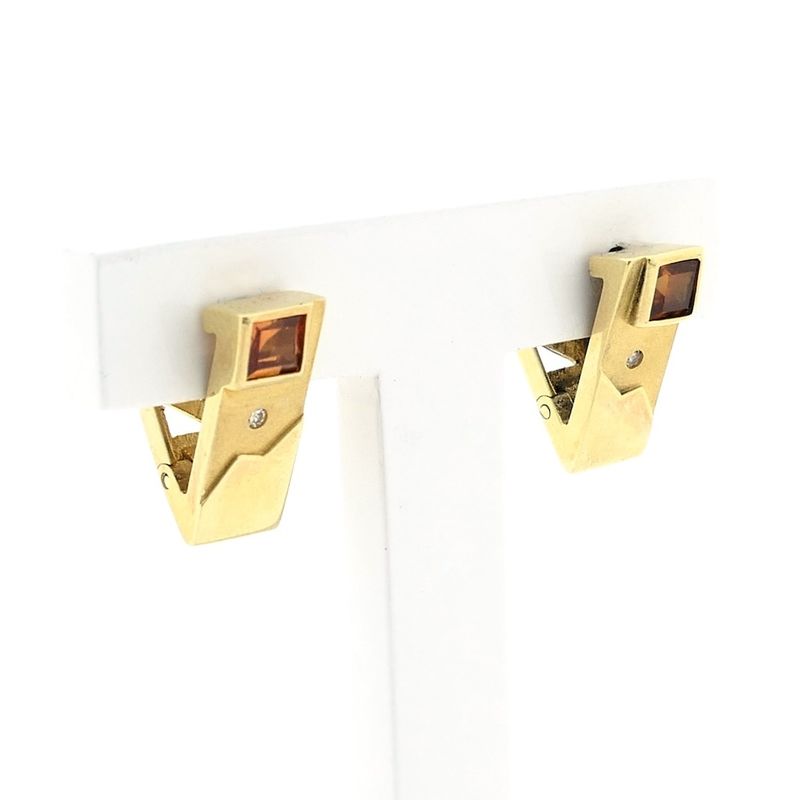 Image 2 of Gold stud earrings with synthetic orange sapphire and zirconia