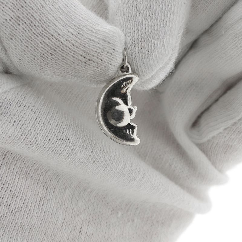 Image 1 of Silver pendant of a moon with a face