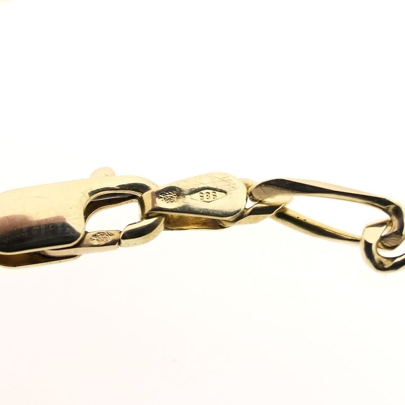 Image 6 of Gold closed Figaro link bracelet.