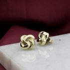 Image 2 of Gold stud earrings with knotted design