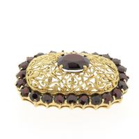 Antique gold brooch with garnet