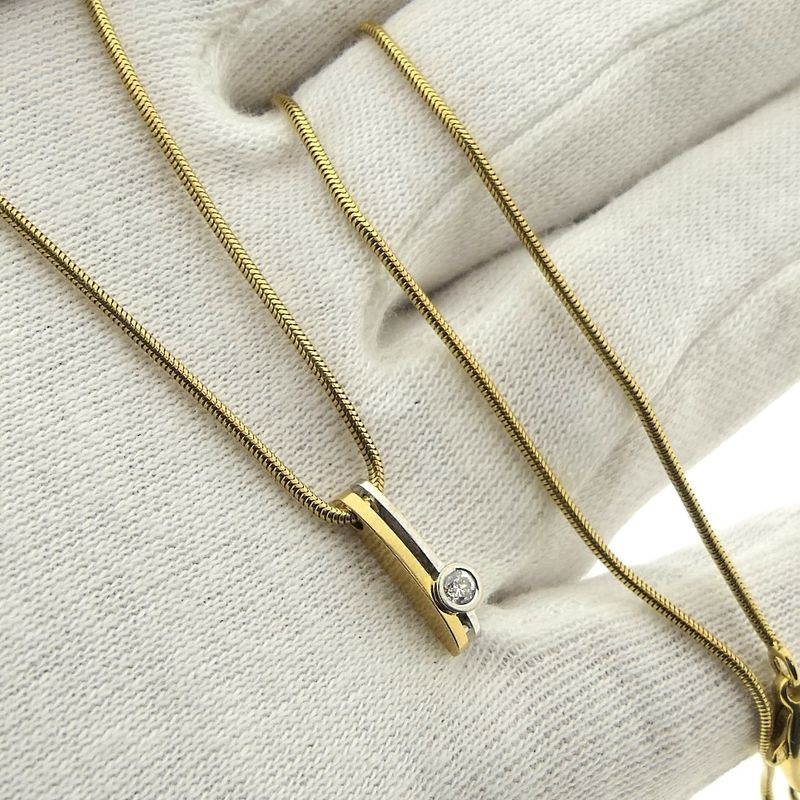 Image 11 of Two-tone gold necklace with fixed pendant and diamond; 0.10 ct.