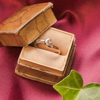 Image 2 of Two-tone gold solitaire ring with 0.035 ct diamond.