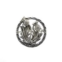 Silver brooch of thistles