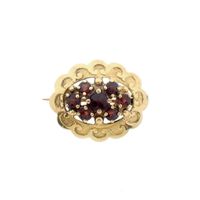 Vintage gold brooch with garnet