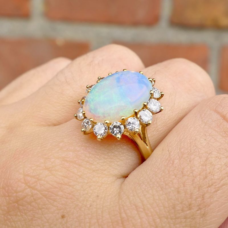 Image 9 of Gold ring with opal and diamond; 1.26 ct.
