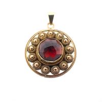Vintage gold pendant with garnet