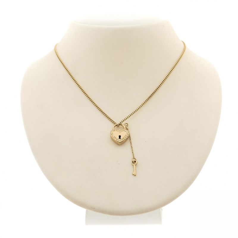 Image 5 of Gold pendant of a heart with a key