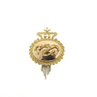 Antique two-tone gold brooch of a cap bell