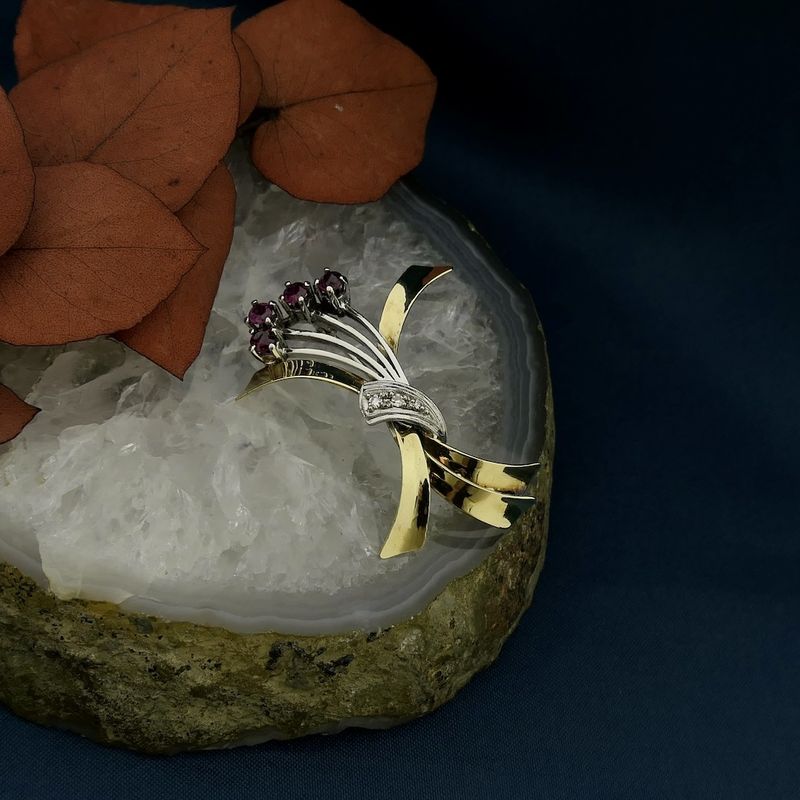 Image 2 of Two-tone gold brooch with ruby and diamonds; 0.06 ct.