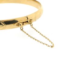 Gold slave bracelet with engravings; Size M
