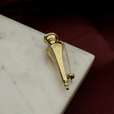 Vintage gold brooch of a knitting needle cap Image 2 of Vintage gold brooch of a knitting needle cap