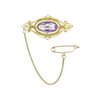 Gold brooch with amethyst.