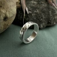 Silver ladies ring with diagonal relief