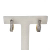 Gold stud earrings with pavé set with diamonds